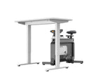 Ingeklapte WalkingPad W1B Office Bike vrijstaand bij een tafel